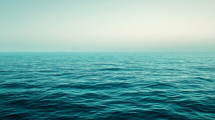 Obraz premium Expansive sea meeting the horizon under soft, cloudy skies with a calm vibe.