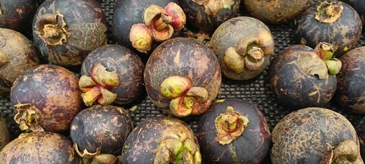 mangosteen fruit on supermarket shelves