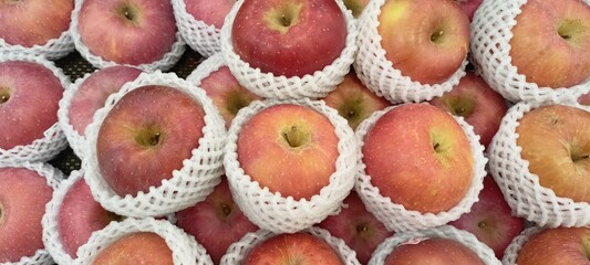 red apples on the supermarket fruit shelf