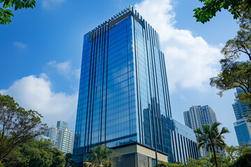 Obraz premium Modern Skyscrapers Against a Blue Sky