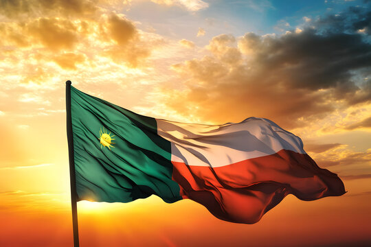 Waving flag of Sudan against the background of a sunset or sunrise. Sudan flag for Independence Day. The symbol of the state on wavy fabric.