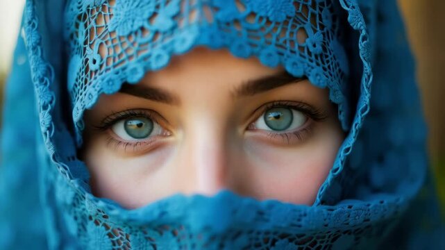 A close-up portrait focusing on the eyes of a Middle East girl wearing a blue lace headscarf, covering most of the face except for the eyes