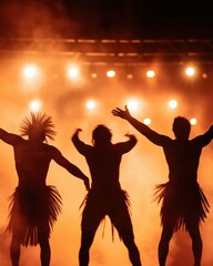 Silhouettes of performers in traditional attire dance against a backdrop of bright stage lights and haze, creating a vibrant atmosphere.
