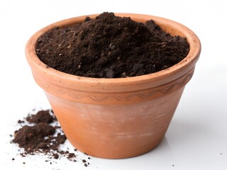 Terracotta pot filled with dark brown soil, isolated on white.