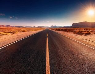 Empty straight asphalt road in the desert