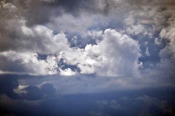 Cloudy pre-storm sky. Dark and white clouds on a background of blue sky