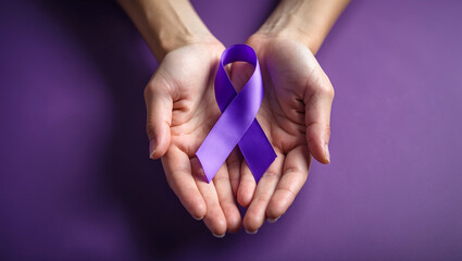 hands holding awareness purple ribbon