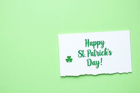 A St Patricks Day setup with a white card and a green message on a green background