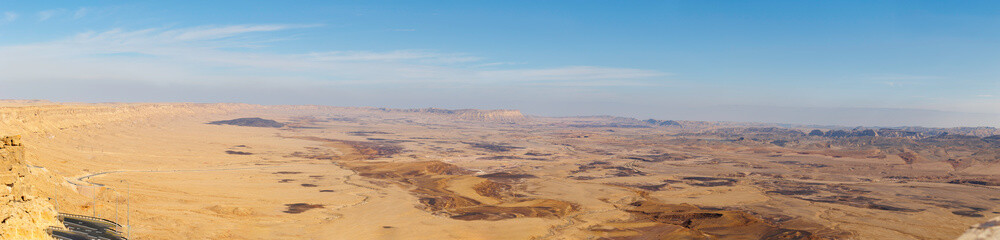 Panoramic view of Makhtesh (crater) Ramon - a geological relief of a large erosional cirque in the Negev Desert, southern Israel. January 17, 2025.