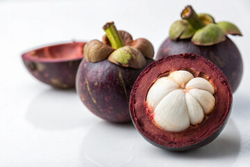 Fototapeta premium Ripe, purple mangosteen fruit, isolated on white background, perfect for healthy desserts
