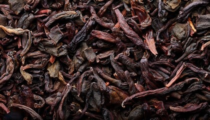 Obraz premium Detailed photograph of loose tea leaves, capturing their texture, color variations and intricate shapes, evoking a sense of comfort and indulging in traditional beverage practices. Texture, background