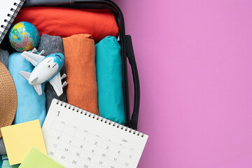 Packing a luggage for a new journey and travel for a long weekend, tourist destination concept