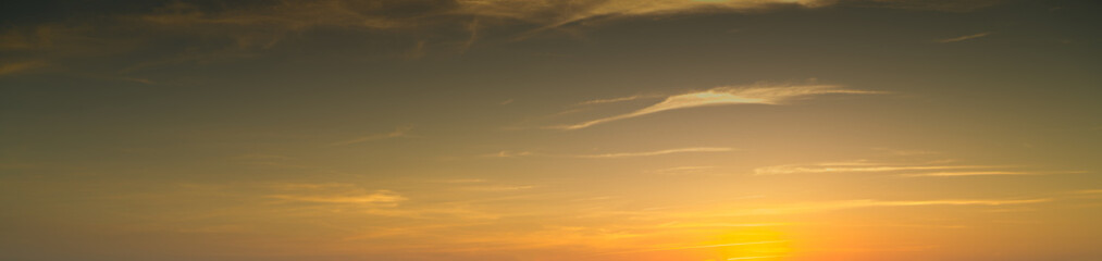 Fototapeta premium Panoramic high resolution image of soft clouds in orange sky