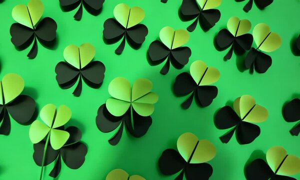 Paper shamrocks covering a wall.