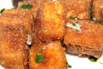 Well Season Batter Fried Tofu Chunks on White Background