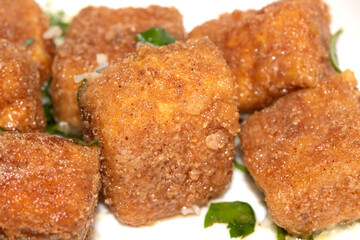 Well Season Batter Fried Tofu Chunks on White Background