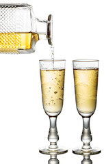 Gold liquor pouring into a glass on a white background.