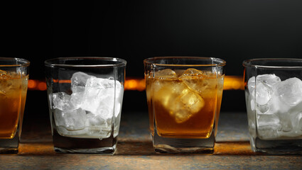 Glasses of whiskey with ice.