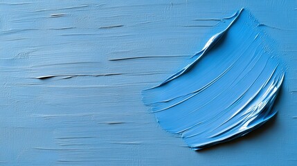 Blue textured paint stroke on a canvas with artistic brush marks