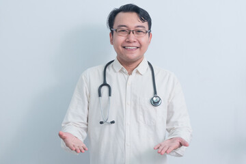 smiling Asian man doctor, male nurse showing and presenting hand pose isolated white background.