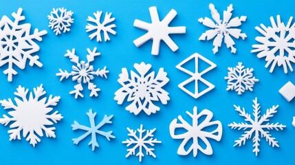 Fototapeta premium Festive White Snowflakes on Blue Background Design