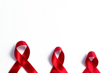 Red ribbons, HIV awareness concept, world AIDS day, world hypertension day, world cancer day with...