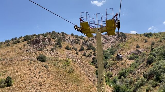 moving up on a chair lift in the summer on the Chimgan mountains