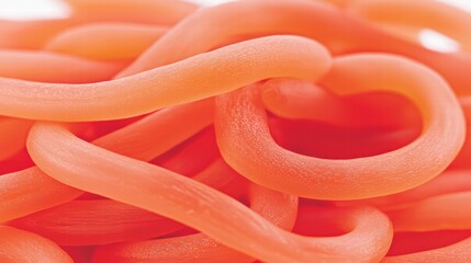 Close-Up of Twisted Orange Pasta on a White Background
