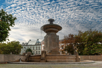 Fototapeta premium Krakow cityscape with fountain in Poland