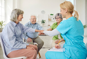 Senior people small group activities for nursing home residents, caring kind nurse, geriatric medicine caretaker in creative activities, assisted living, female doctor visit caregiving to support help