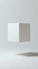 Minimalistic floating cube with soft shadows on a neutral background, showcasing simplicity and elegance in design.