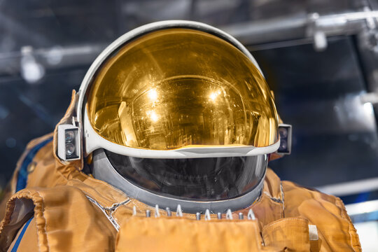 Working spacesuit against technology background - Powered by Adobe