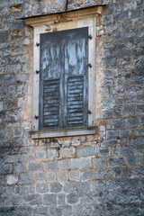 Old weathered Window in Stone Wall