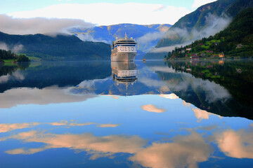 Norway, Ulvik. Cruise ship anchored in Ulvik fjord. Amazing nature view with fjord and mountains....