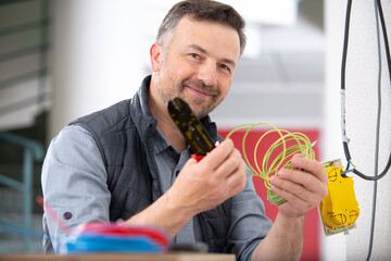 electrician engineer works with electric wires