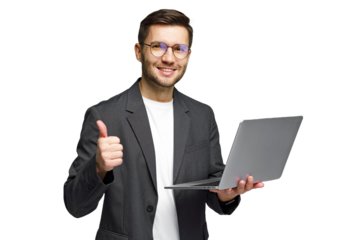 Young man gives thumbs up while holding laptop, showing success in digital work environment