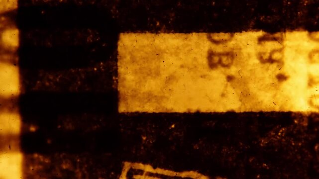 Scraps of an old Soviet newspaper.  Abstract loopable animation. 35mm film