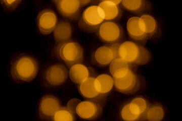 Fototapeta premium golden bokhe at night,Beautiful blurred light bokhe for background material.