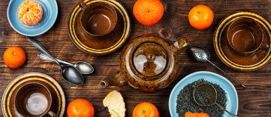 Glass kettle of tangerines tea.