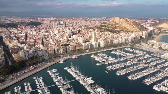 Panoramic aerial view of Alicante Marina. View of the main boulevard of the city and promenade area. Famous travel destination in South of Spain.
Drone forward.