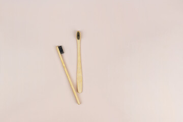 Bamboo eco-toothbrushes on light background. Eco-friendly consumption, dental health, healthy lifestyle, self-care, dentistry and dental clinic, oral health. Copyspase for text