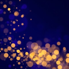 Obraz premium Abstract gold bokeh on blue background.