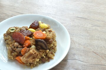 sticky rice steam with pork and salt egg couple wholegrain of Chinese Duanwu festival on plate