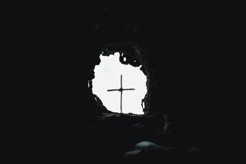 Easter resurrection concept. Jesus Christ resurrection. Empty tomb of Jesus with light. Born to...