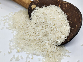 Unprocessed rice, on a natural blurred white background.