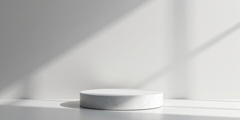 A Minimalist White Cylindrical Pedestal Display in a Sunlit Room with Subtle Shadows