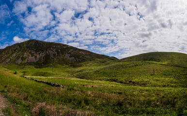 Serene Hills and Verdant Landscapes Near the Start of Minffordd Path to Penygader (Cadair Idris) Under a Sky of Billowing Clouds