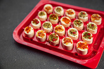 cheese appetizer soft cheese with herbs and tomatoes pieces fresh tasty food dish delicious gourmet food background on the table rustic food top view copy space