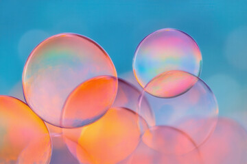 Colorful soap bubbles vibrant blue sky