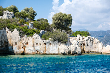 Sunken Lycian town view on Kekova island near Kas, Antalya district, Turkiye. The Kekova region is steeped in history, with ruins of ancient settlements around every corner. The turquoise water 